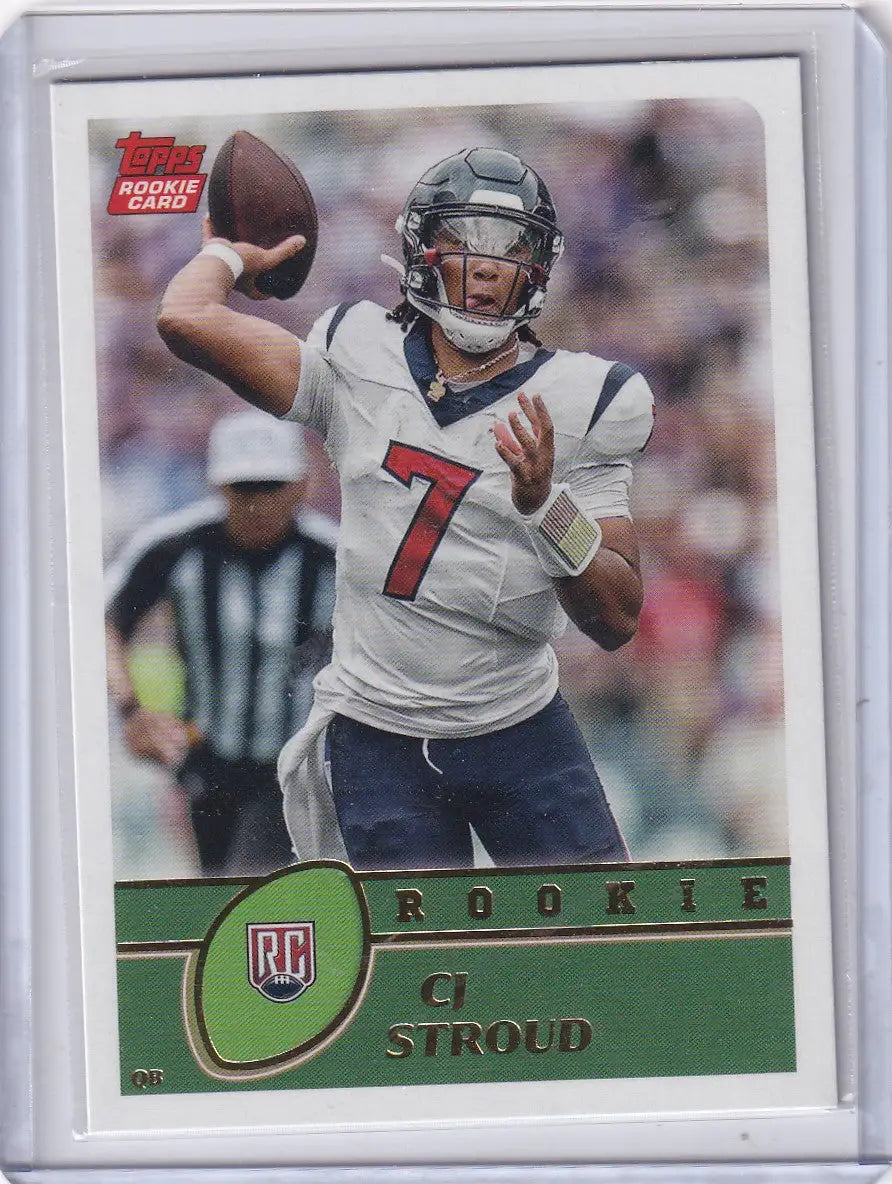 Topps rookie card of CJ Stroud in protective sleeve featuring Houston Texans memorabilia