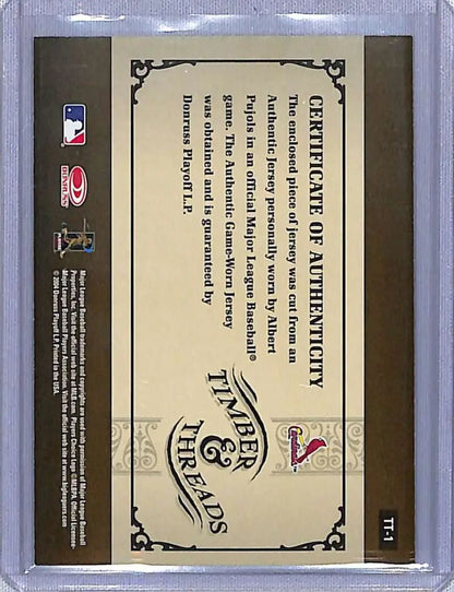 Back side of 2005 Donruss Albert Pujols baseball card showing certification and threads bat logos