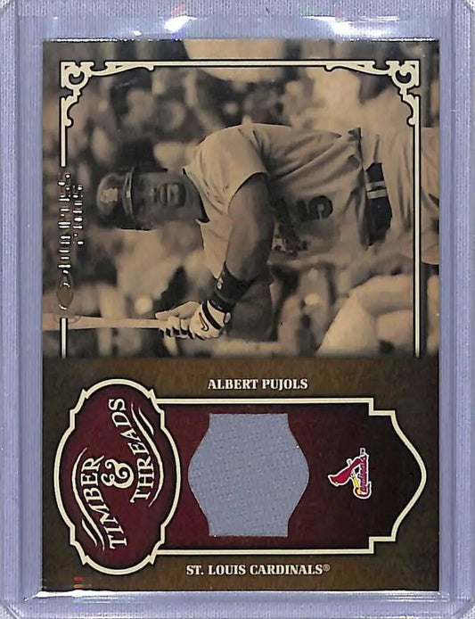 Baseball card of Albert Pujols in sepia, featuring Timber and Threads bat action photo