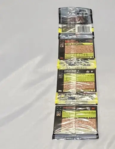 Stack of unopened 2007 Topps Baseball card packs featuring Pudge Rodriguez, Chipper Jones, Zach Duke