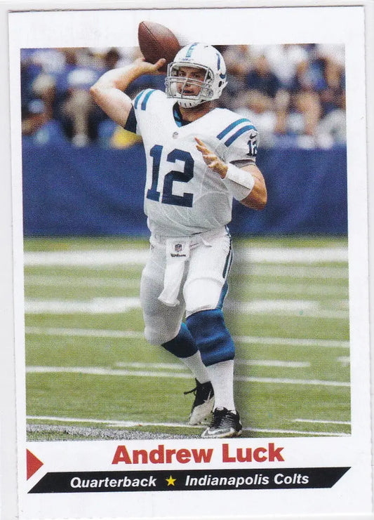 Andrew Luck throwing a pass in white and blue uniform for Indianapolis Colts Sports Illustrated