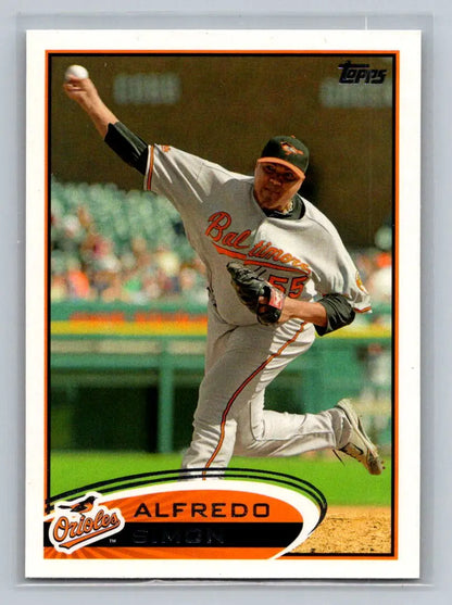 2012 Topps #22a Alfredo Simon baseball card featuring the Baltimore Orioles pitcher