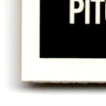 Corner of framed black sign with white text showcasing Topps Baseball Heritage Thomas Neal Indians Jaye Chapman Cubs #146