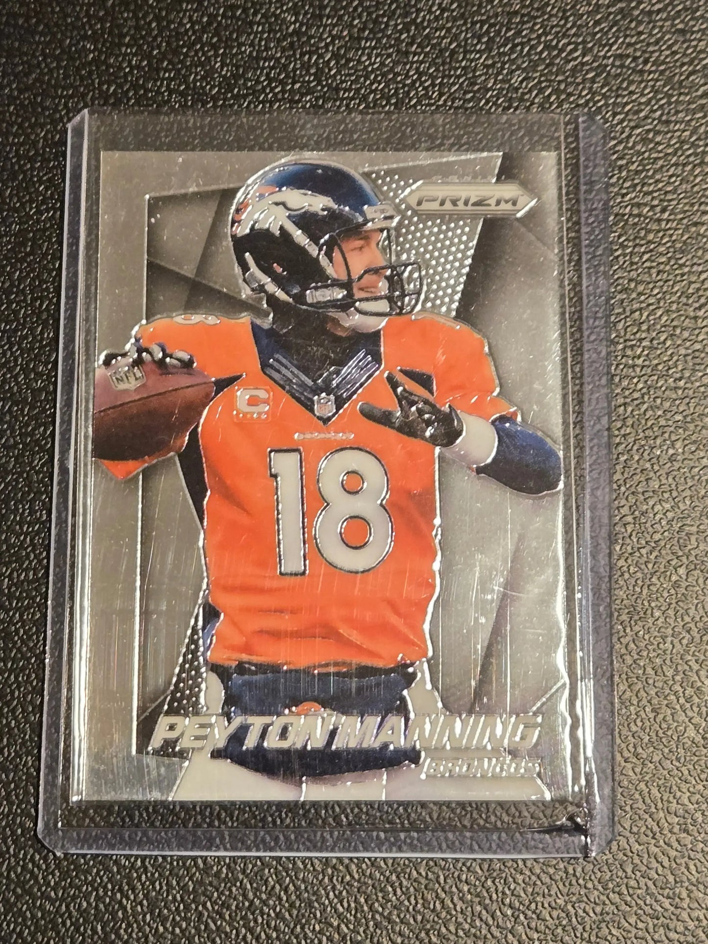 Peyton Manning football card from 2014 Panini Prizm series displayed in product