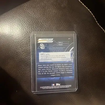 Baseball card in protective case featuring 2018 FERNANDO TATIS JR. ROOKIE REFRACTOR Bowman Chrome