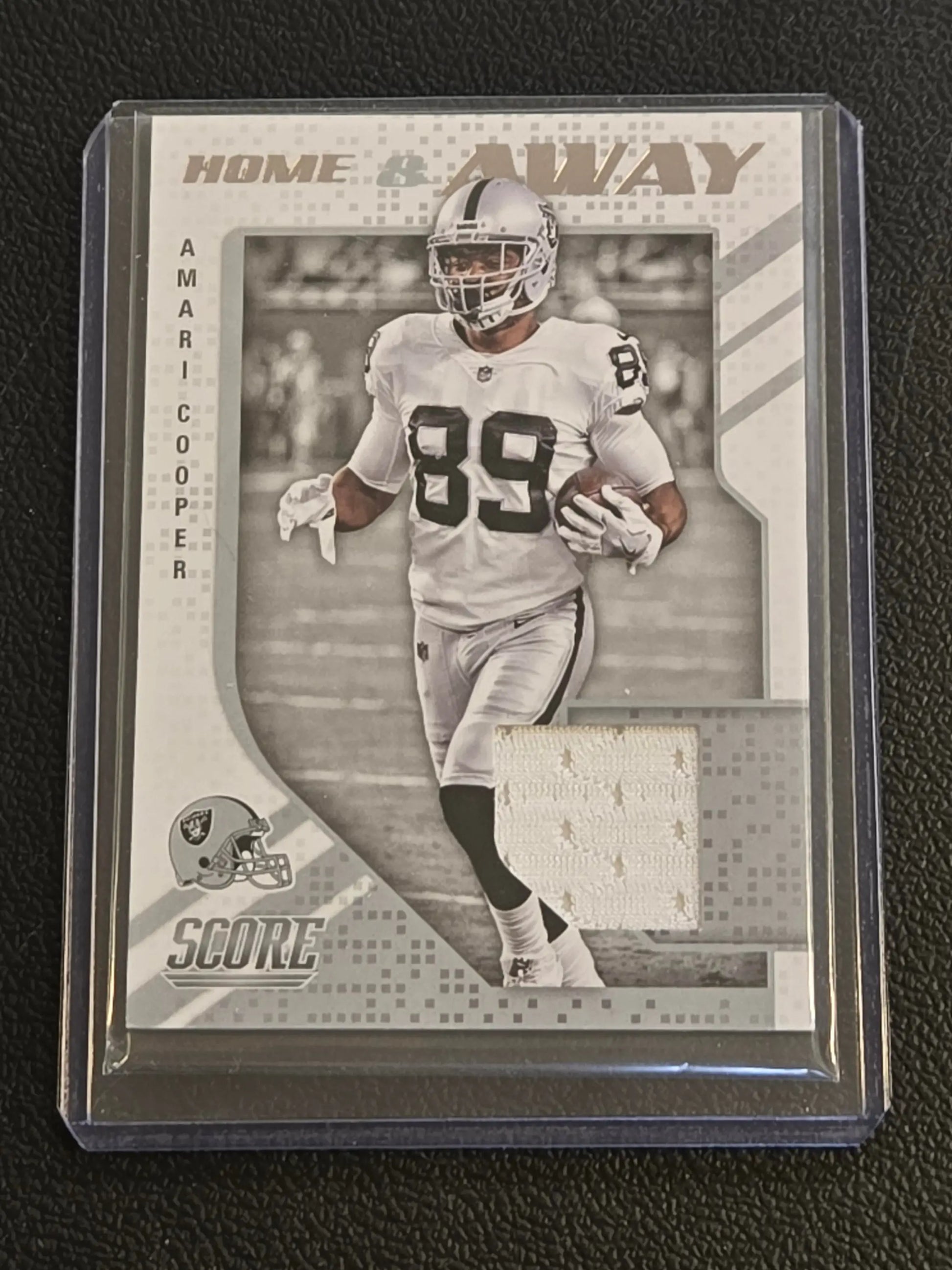 Amari Cooper football trading card with jersey patch from 2018 Score Cooper Home collection