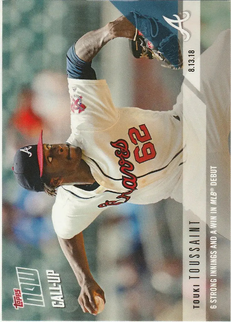 Baseball player Touki Toussaint in Braves uniform mid-pitch during MLB debut