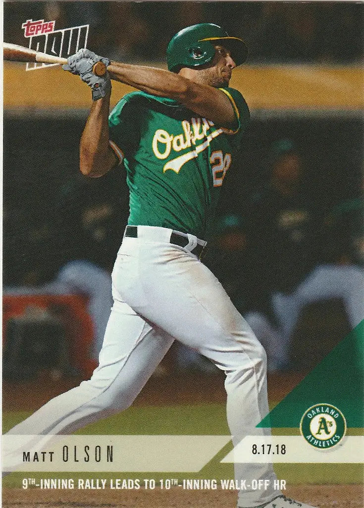 Baseball player in green Oakland Athletics uniform swinging bat during 9th inn rally