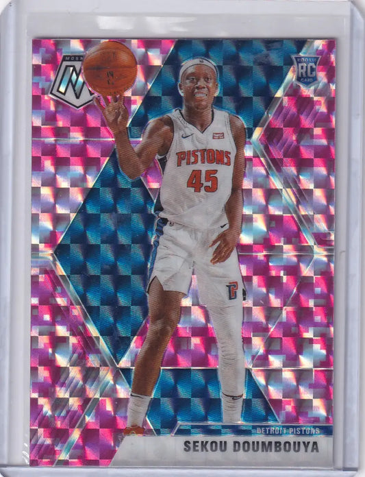 Basketball trading card featuring Sekou Doumbouya in Detroit Pistons uniform with mosaic pink reactive background