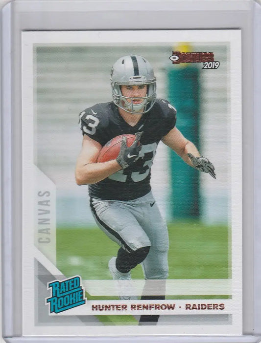 Football trading card of Hunter Renfrow Oakland Raiders running with the ball in black jersey