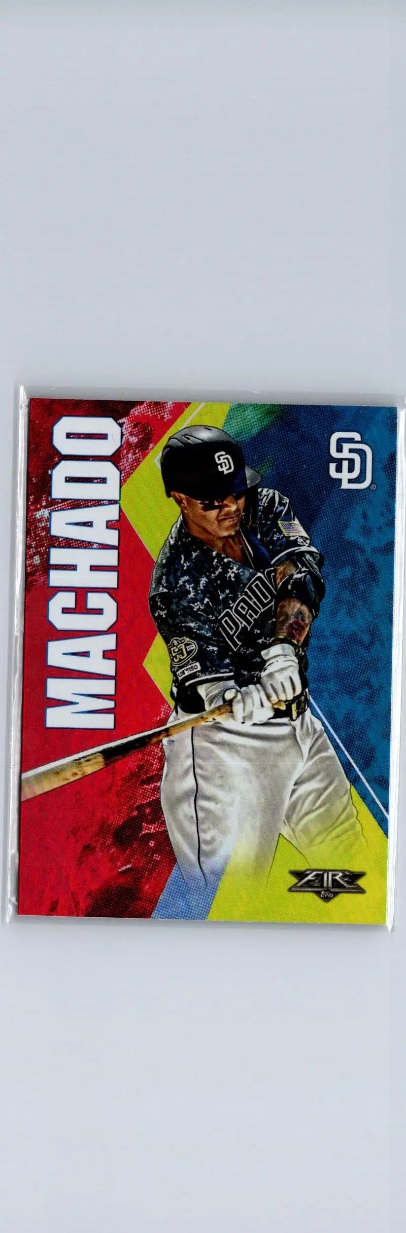Baseball trading card of Manny Machado Flame swinging bat in Padres uniform with vibrant background