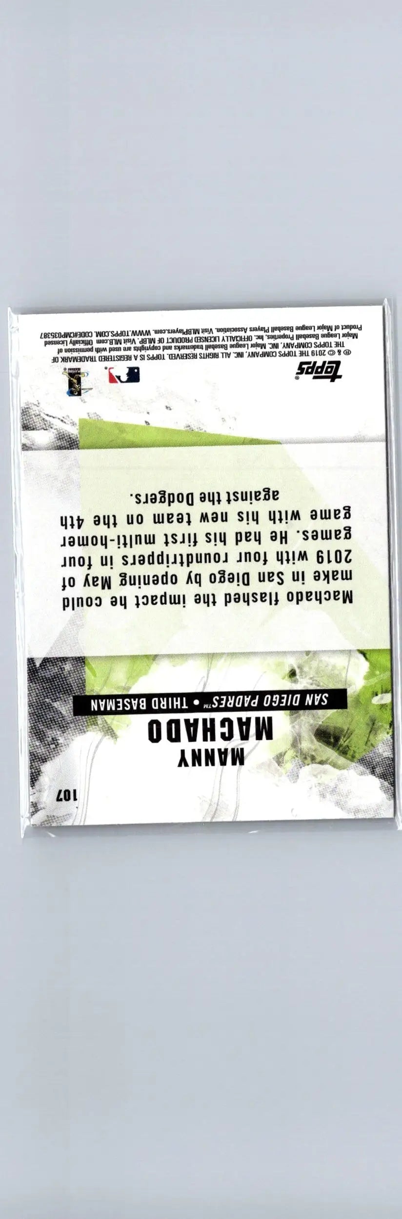 Baseball card in protective sleeve featuring Manny Machado Flame from 2019 Topps Fire