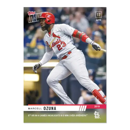 Baseball player Marcell Ozuna in a white uniform swinging bat for 5th HR win Cardinals
