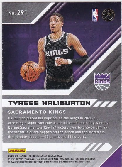 Basketball trading card of Tyrese Haliburton dribbling for Chronicles XR Green Sacramento Kings