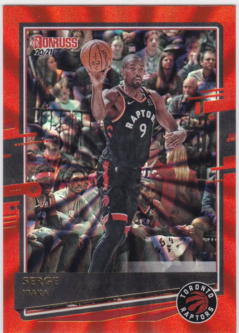 Basketball trading card of Serge Ibaka in action, featuring Ibaka Orange Laser design