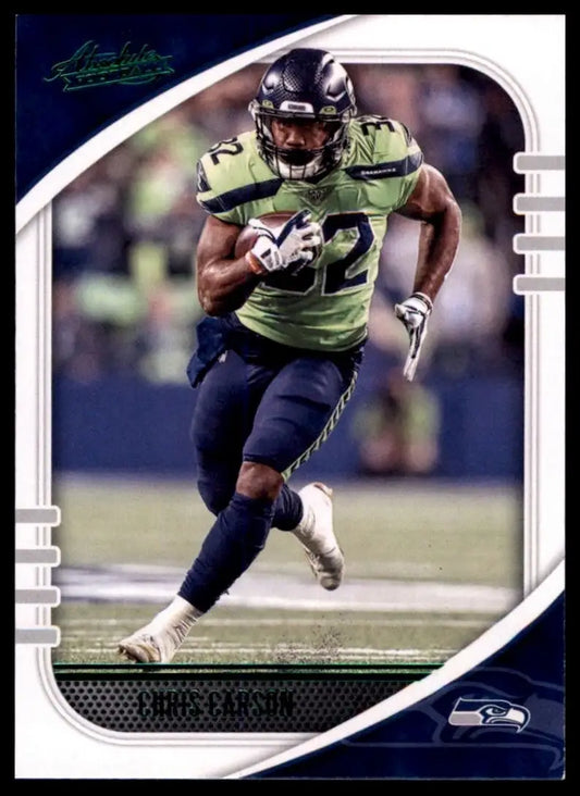 Football card featuring a running player in green and navy uniform from 2020 Panini Absolute Green Chris Carson NFL set