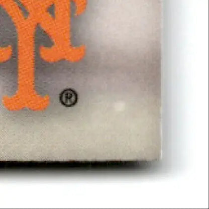 Corner of textured off-white card with orange Mets Brandon Nimmo logo for Topps Baseball