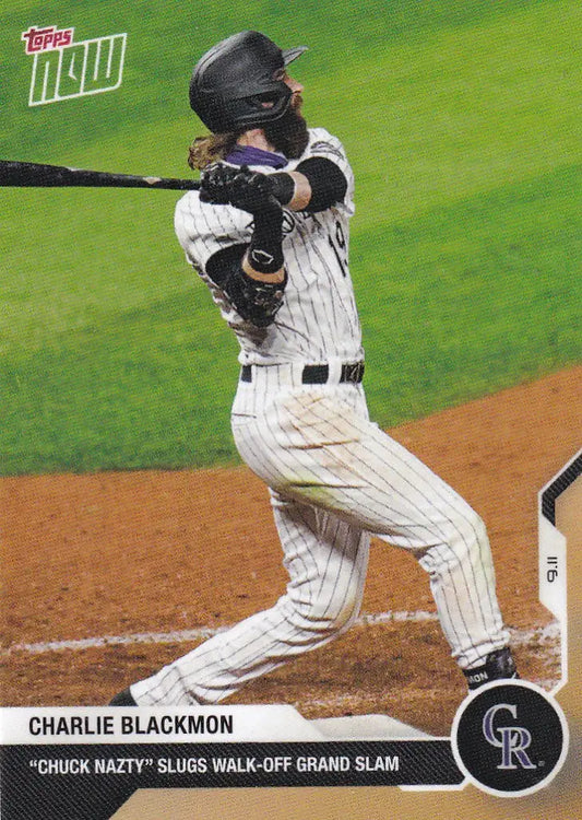 Charlie Blackmon swinging a bat in pinstriped uniform for Colorado Rockies
