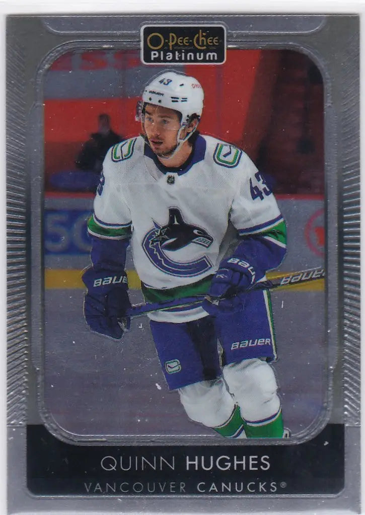 Hockey trading card of Quinn Hughes, Vancouver Canucks player in white jersey