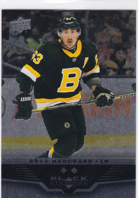 Hockey player in black and yellow Boston Bruins jersey, showcasing Brad Marchande double diamond