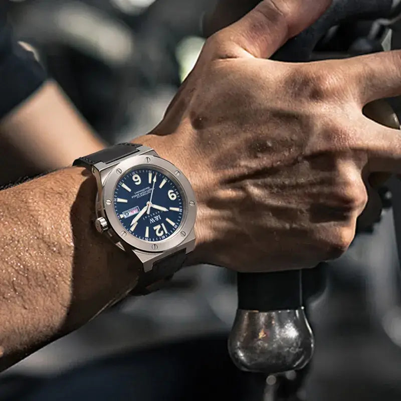 Robust silver-toned men’s watch with dark blue dial, black strap, 50M water resistance