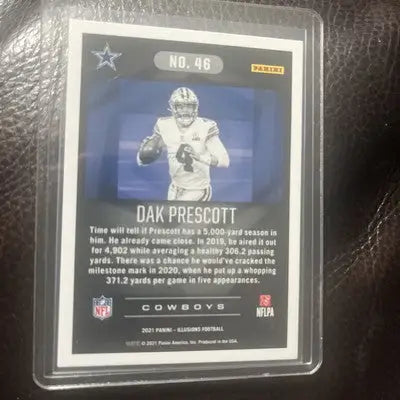 2021 Panini Illusions Dak Prescott football card with emerald green insert for Dallas Cowboys