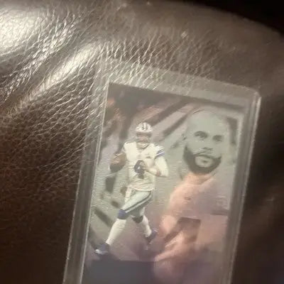 Panini Illusions Dak Prescott football card with emerald green insert from 2021 Panini Illusions