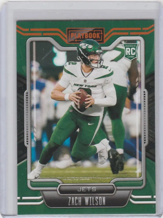 Football trading card of Zach Wilson in throwing stance from 2021 Panini Playbook Gold