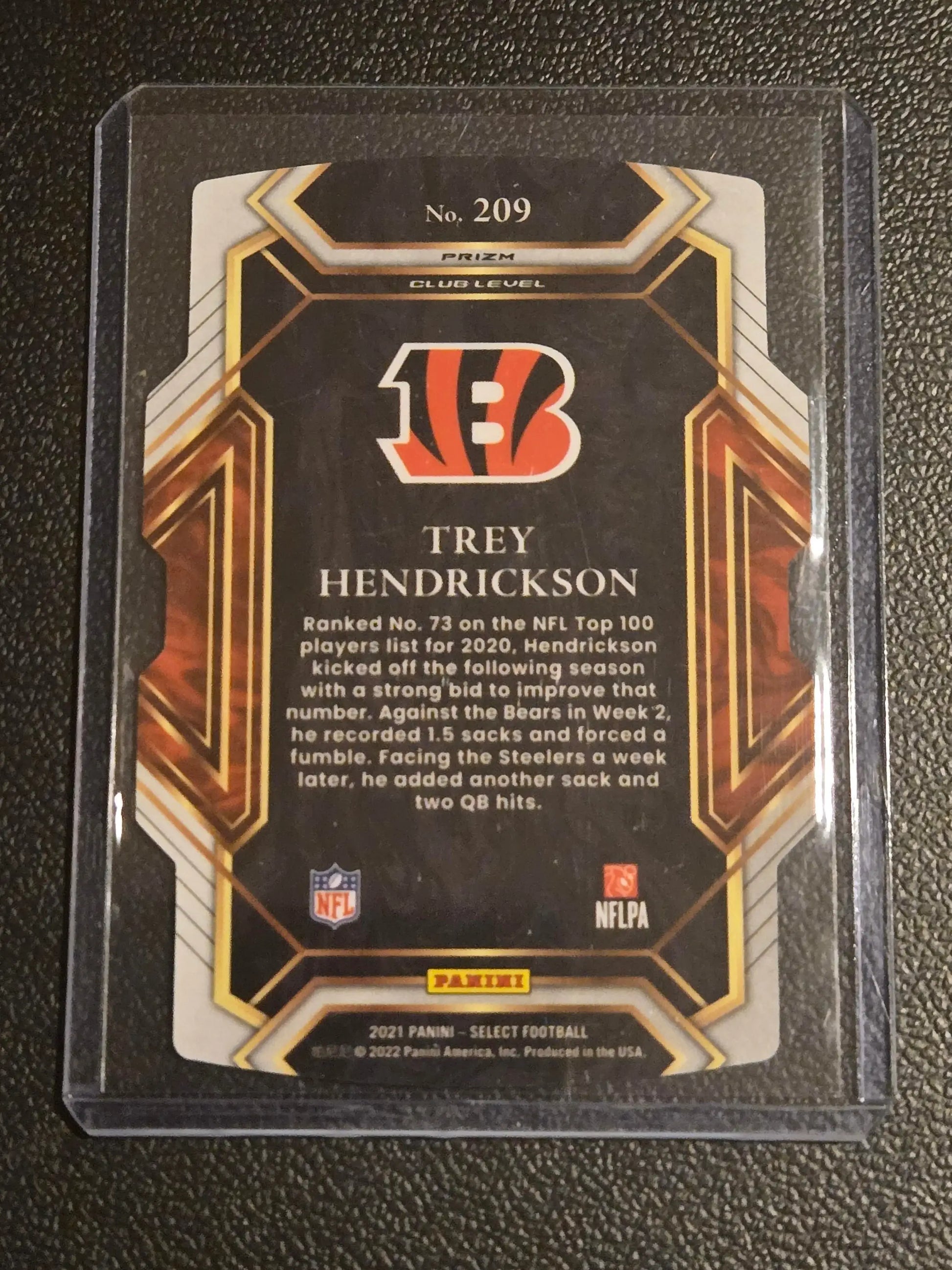 Collectible Trey Hendrickson Black and Gold Prizm Die Cut trading card from 2021 Panini Select