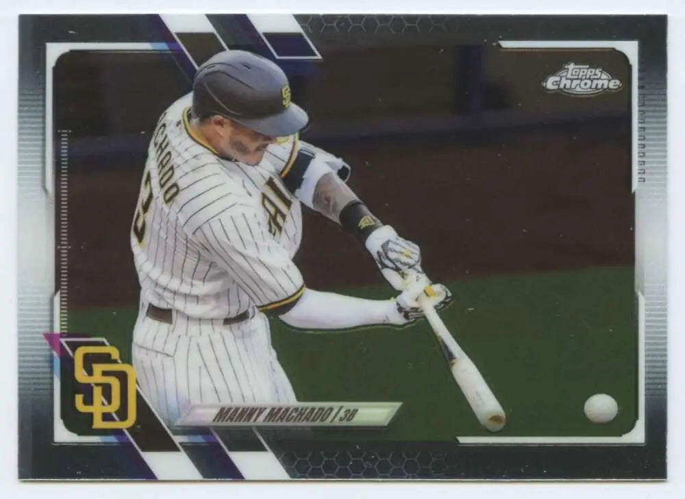 Manny Machado swinging bat in San Diego Padres pinstripe uniform during game