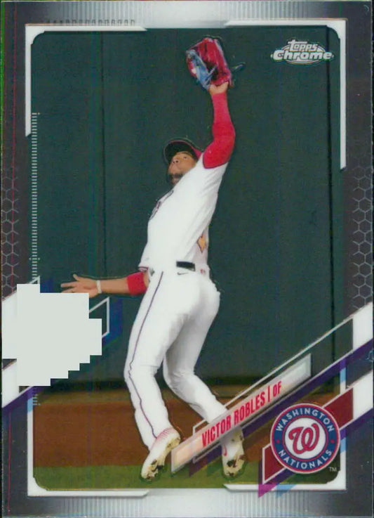 Victor Robles making an impressive catch in a white Washington Nationals uniform