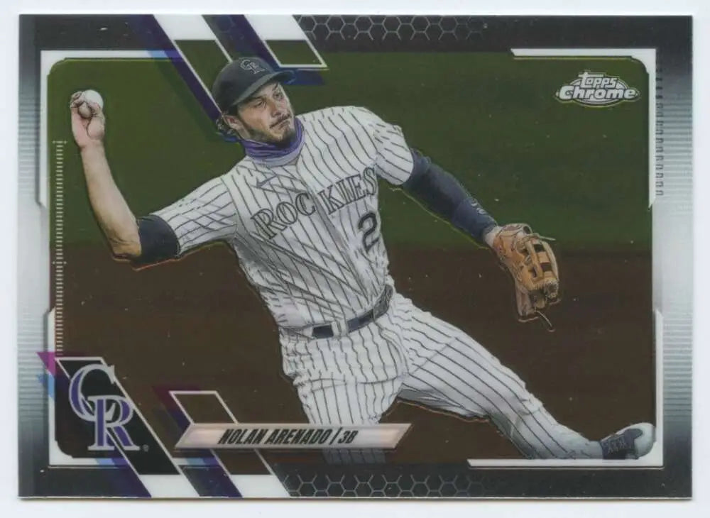 Nolan Arenado making a defensive play on a Colorado Rockies baseball card
