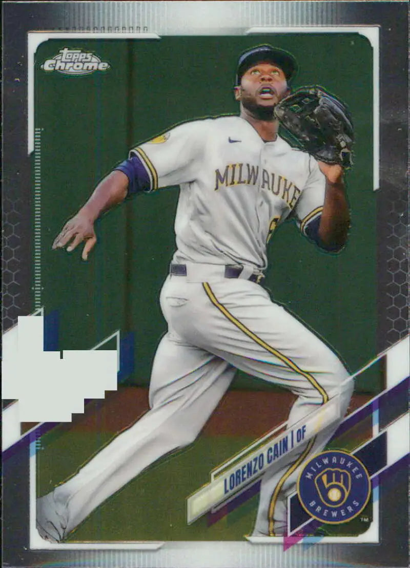 Baseball player fielding in white Milwaukee Brewers uniform top of 2021 Topps Chrome card