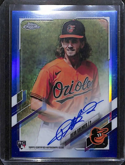 Blue-bordered Topps Chrome Baseball Card of Dean Kremer in orange jersey with autograph