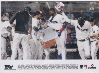 Miami Marlins players celebrating with water after game featuring Lewin Diaz Miami