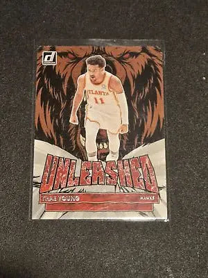 Trae Young Unleashed basketball card from 2022-23 Donruss featuring Atlanta Hawks star