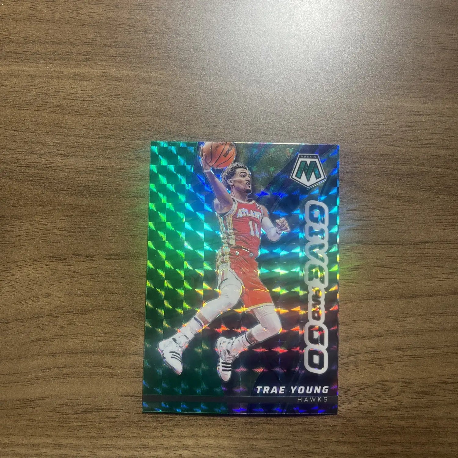 Trae Young basketball card from 2022-23 Panini Mosaic Basketball Give And Go Mosaic Green