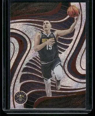 Basketball trading card featuring Nikola Jokic in black Denver Nuggets jersey from Panini Revolution Basketball