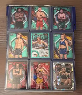 UFC trading card lot in protective sleeves featuring rookies, vets, Prizm, Refrac, and base cards