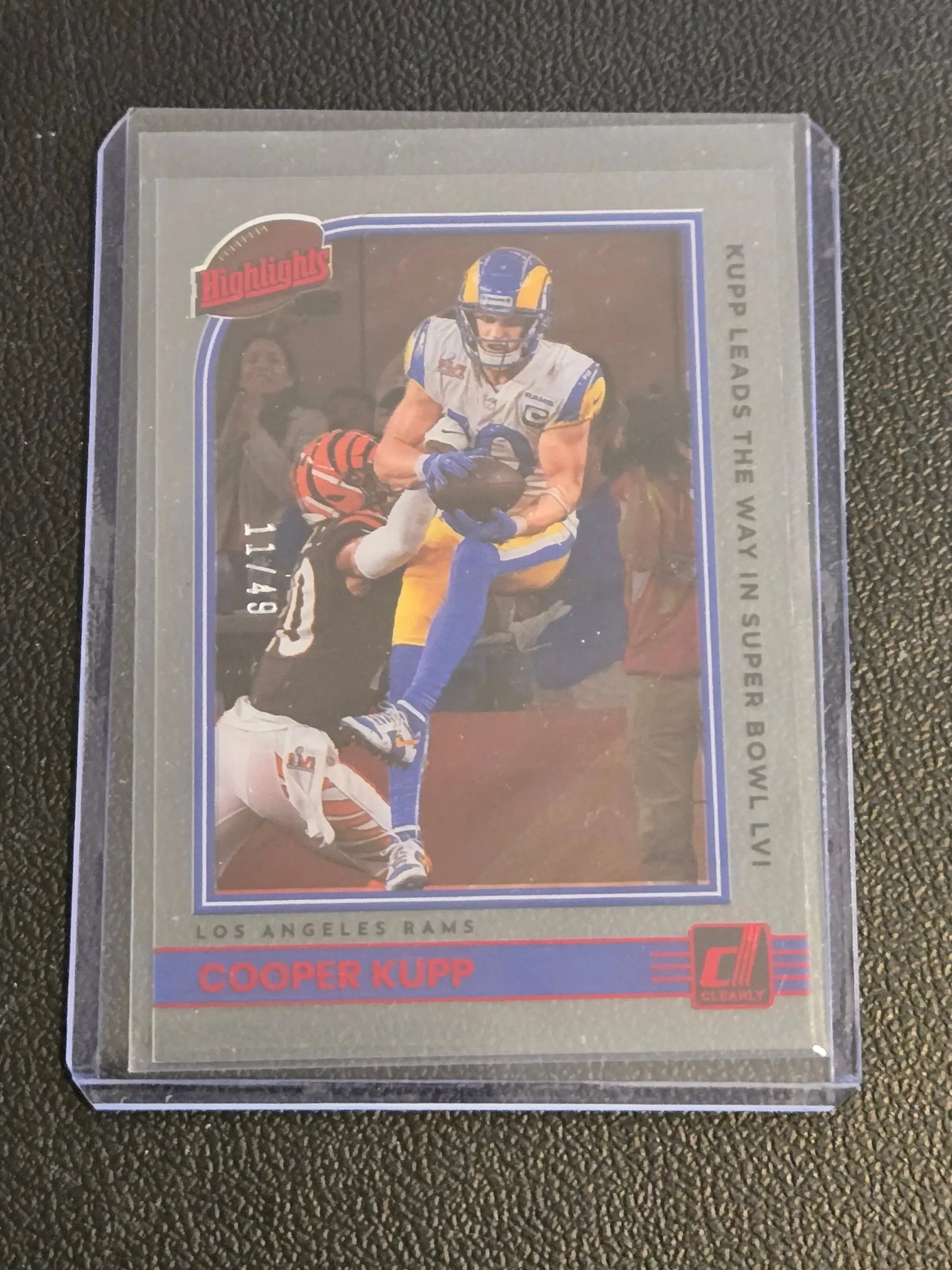 Football trading card featuring Cooper Kupp highlights red from 2022 Clearly Donruss