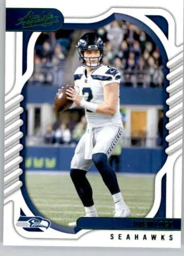 Football player in white Seattle Seahawks uniform, showcasing 2022 Panini Absolute Green