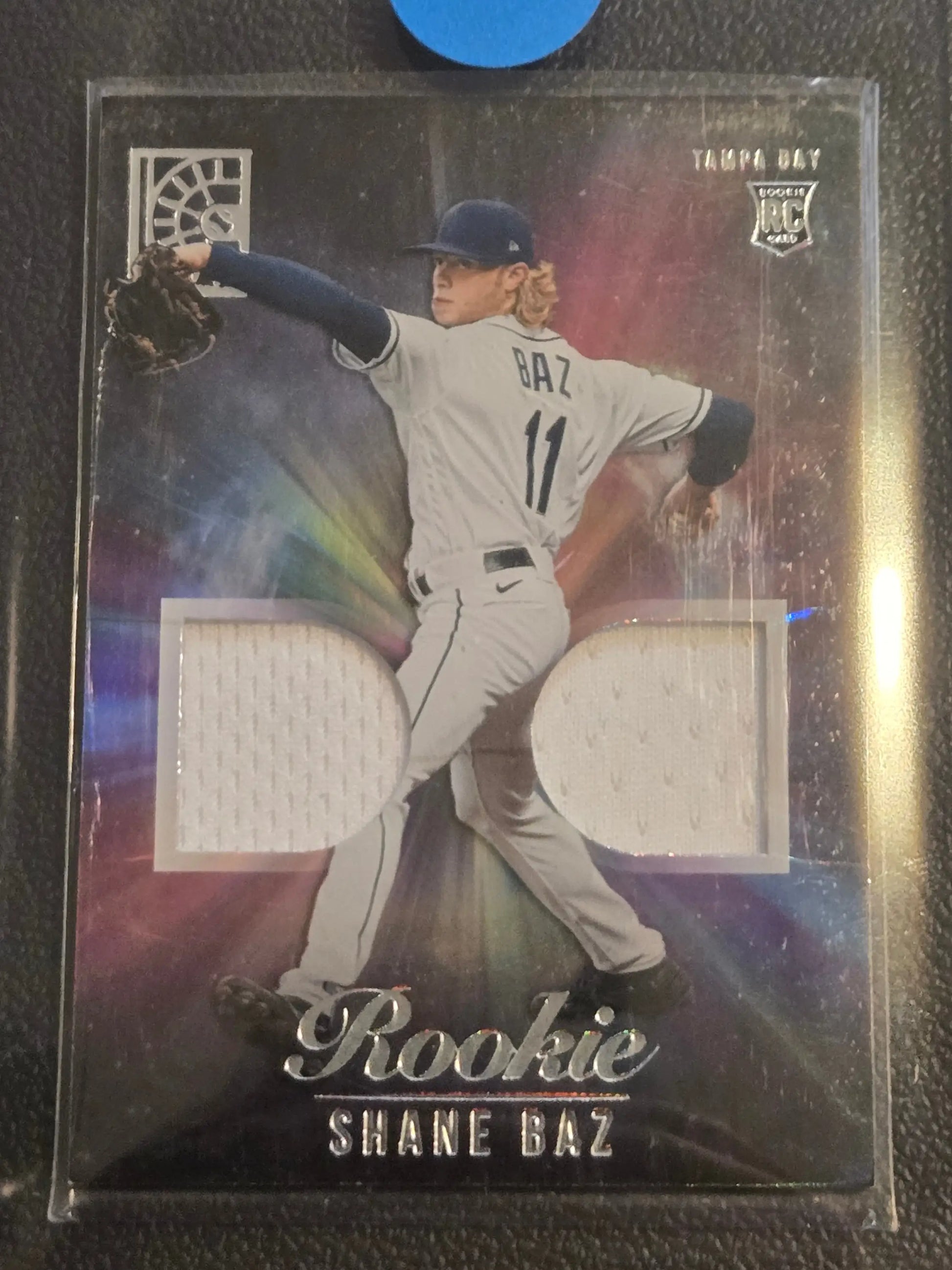 Baseball trading card of Shane Baz rookie with dual game-worn jersey swatches