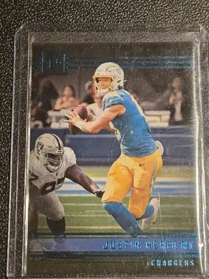 Justin Herbert football card from 2022 Panini Chronicles in teal featuring Justin Herbert Panini
