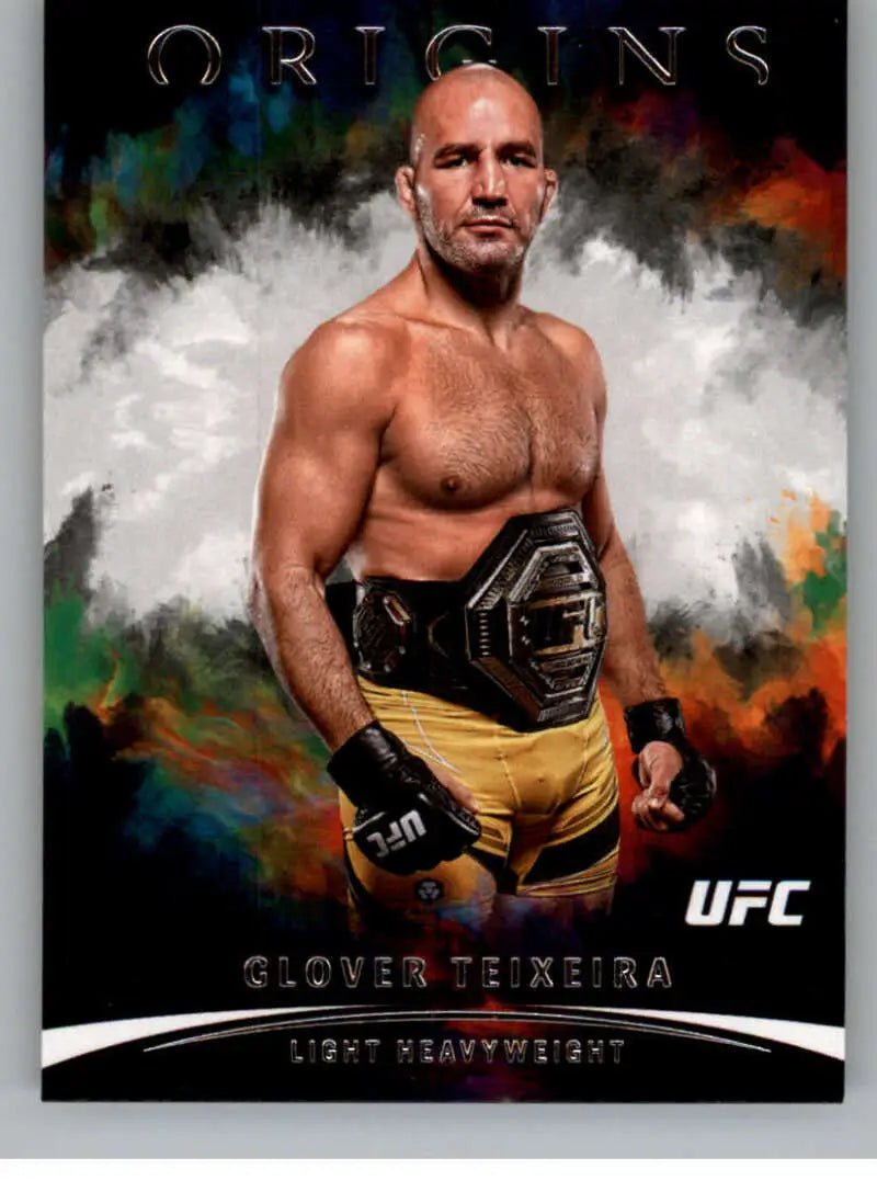 Shirtless Glover Teixeira in yellow shorts with championship belt for Panini Chronicles UFC card