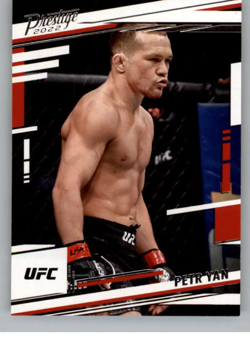Shirtless UFC fighter Petr Yan in red gloves in the octagon for Panini Chronicles UFC card