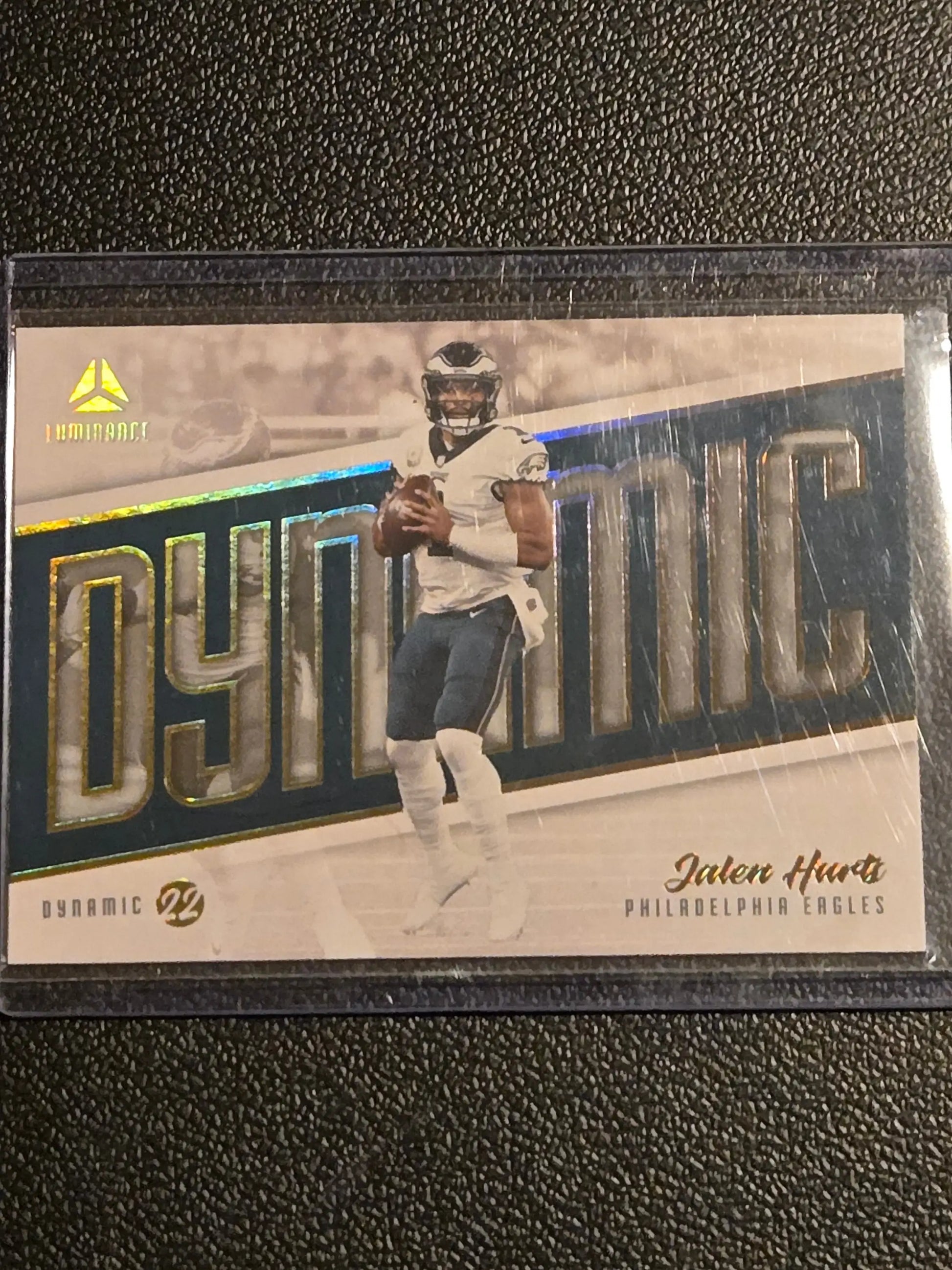 Football trading card of Jalen Hurts Dynamic in protective sleeve, 2022 Panini Luminance