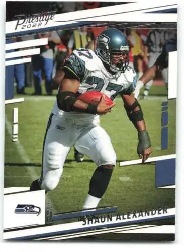 Seattle Seahawks Shaun Alexander carrying the ball in a 2022 Panini Prestige original gloss