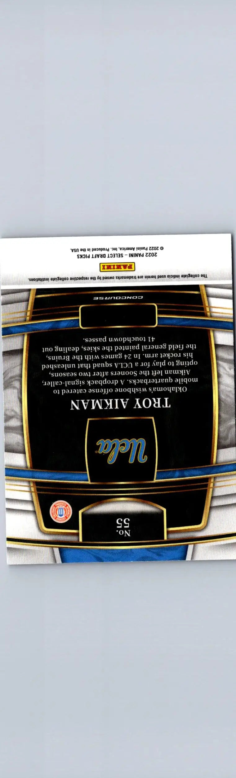 Football trading card featuring Troy Aikman from 2022 Panini Select Draft Picks with black background and blue gold accents