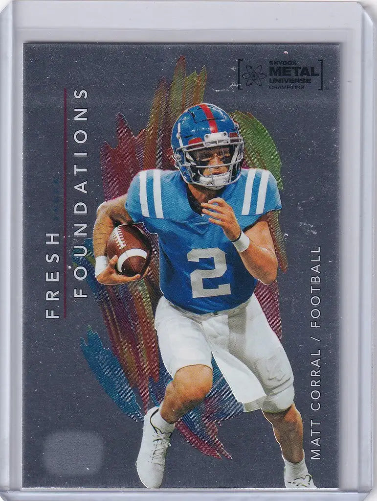 Football player in blue and white uniform running with ball from Skybox Metal Universe