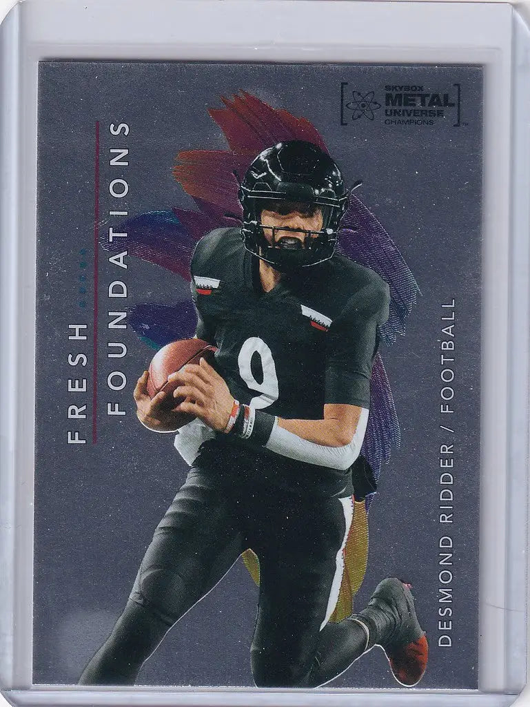 Football player in black uniform running with football for Skybox Metal Universe Champions